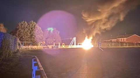 Bench on fire in a park