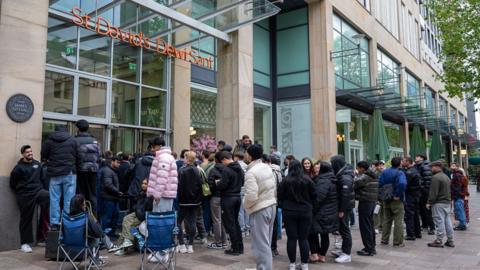 People queuing outside Cardiff's St David's shopping Centre 