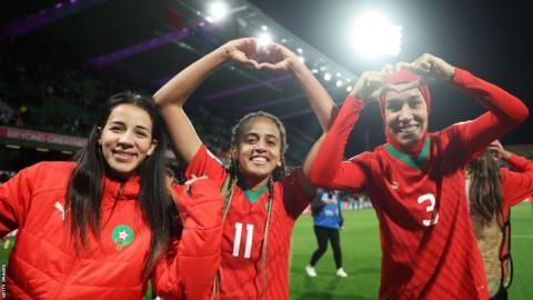 Morocco players celebrate qualifying for the World Cup last 16