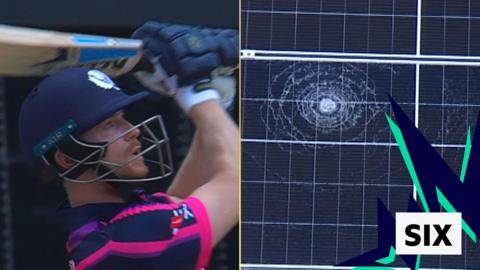 Scotland's Michael Jones smashes a solar panel