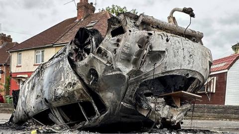 Husk of burned out car