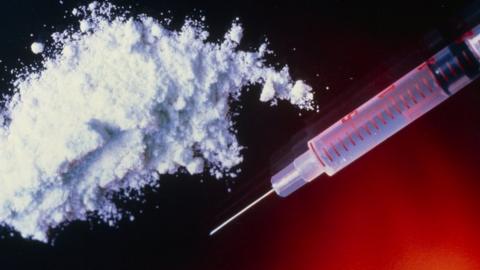 Syringe and heroin powder - generic