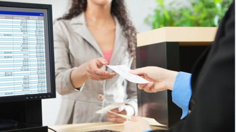 Woman at bank counter