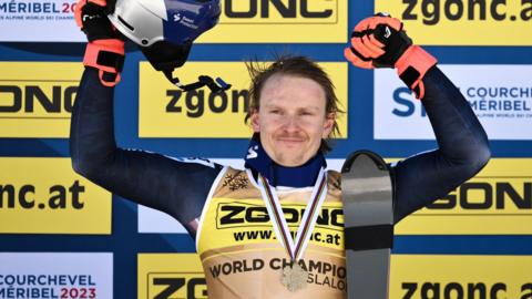 Henrik Kristoffersen celebrates his slalom world title