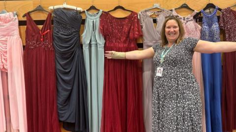 Nicki Burgess with donated prom dresses