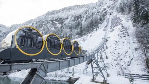 The world's steepest funicular railway, the Stoos Bahn, is inaugurated in Stoos, Switzerland on 15 December 2017