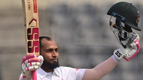 Mushfiqur Rahim acknowledges applause after he reaches his century in Mirpur