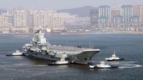 Aircraft carrier Liaoning sets for sea trial at Dalian shipyard with the help of towboats after nearly one year of maintenance on February 29, 2024 in Dalian, Liaoning Province of China.