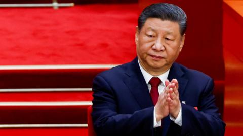 Chinese President Xi Jinping in a suit attends the opening session of the National People's Congress (NPC) at the Great Hall of the People in Beijing, China, March 5, 2025