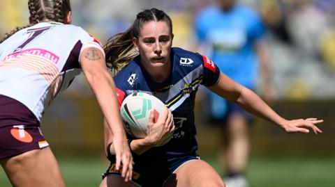 Francesca Goldthorp runs the ball for North Queensland in the NRLW