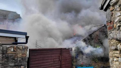 Close up of smoke from the outbuilding fire