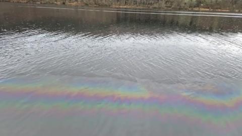a rainbow slick from a fuel leak on a roer