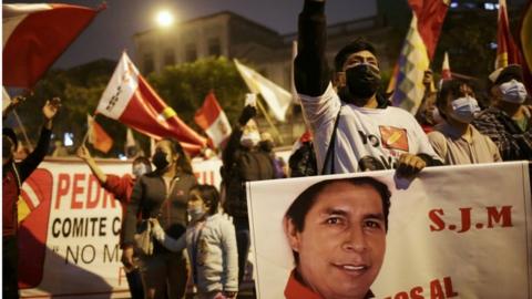 Supporters of Peru's presidential candidate Pedro Castillo gather along a street the day after a run-off election, in Lima, Peru June 7, 2021