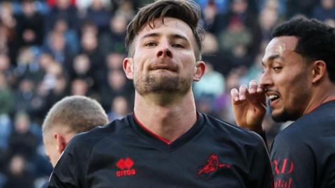 Ryan Leonard celebrates scoring