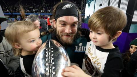 Bryan Braman holds his two daughters and the Super Bowl trophy in 2018 