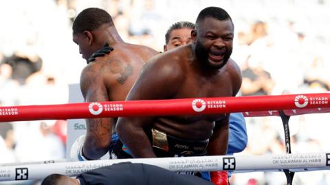 Martin Bakole celebrates