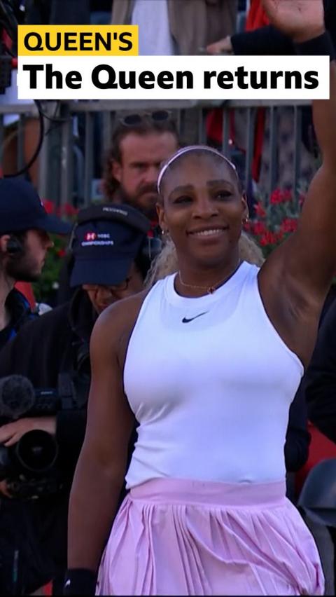 Serena Williams smiles and waves