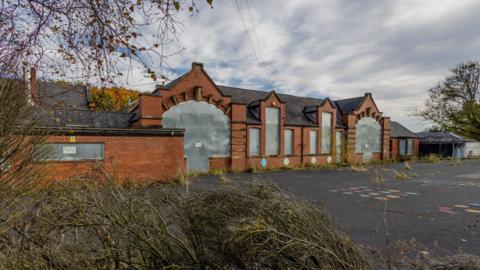 The former Bluebell Meadow Primary School site in Trimdon Grange. The site is derelict with all of its windows boarded up