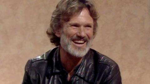 Kris Kristofferson smiling in studio mid interview