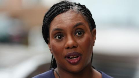 Badenoch talks to a reporter