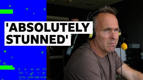 Michael Vaughn reacts to Ben Stokes' retirement from the comms booth as England play New Zealand in the men's Test match series.