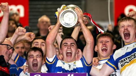 Darragh Canavan lifts the trophy