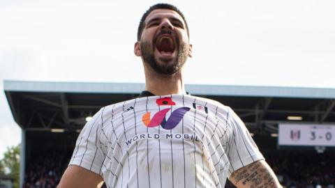 Aleksandar Mitrovic celebrates his third goal