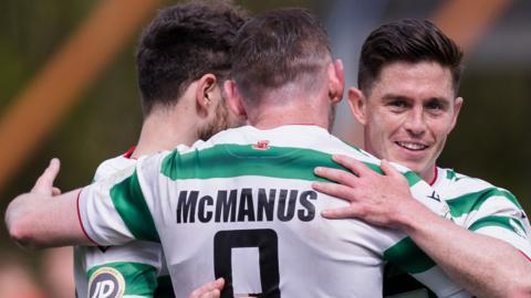 Declan McManus celebrates with TNS team-mates