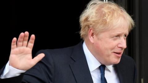 Boris Johnson leaves his hotel in Manchester on Sunday morning