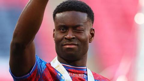 Crystal Palace's Marc Guehi acknowledges the crowd after the FA Cup final