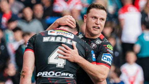 Jake Wardle of Wigan celebrates with Jai Field after scoring a try