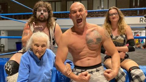 Jane pictured with wrestlers ‘Mjr Lee Buff, Abi Cartwright and Sassy Bear Clarence’