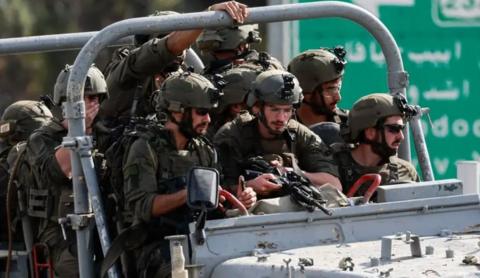 Israeli soldiers in a vehicle