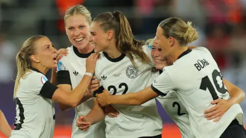 Jule Brand celebrates