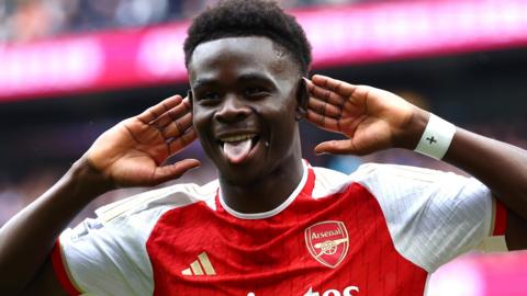 Bukayo Saka celebrates scoring for Arsenal against Tottenham Hotspur