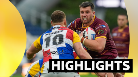 Huddersfield's Joe Greenwood goes into a tackle