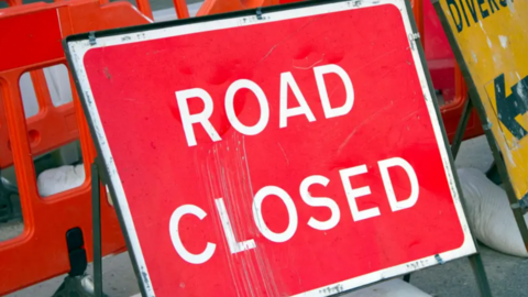 A stock picture of a red road closed sign.