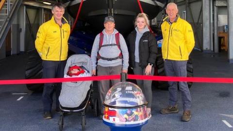 Nigel Davies, second left, with daughter, Lauren, grandson Hunter-Ross, RNLI mechanic Alwyn Roberts and operations manager Andy Vowell