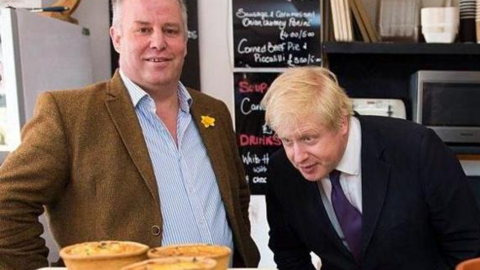 Andrew RT Davies with then Prime Minister Boris Johnson, who is looking at pies in a shop