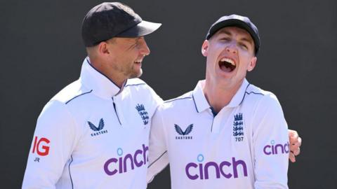 England batters Joe Root (left) and Harry Brook (right) laugh as they pose for a photo