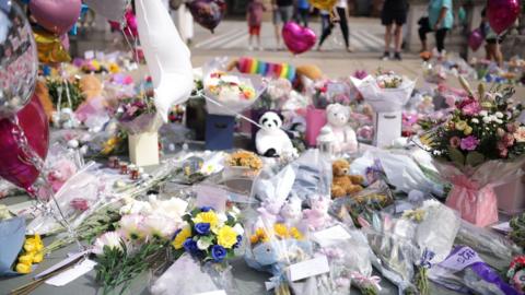 Floral tributes and teddies left in Southport