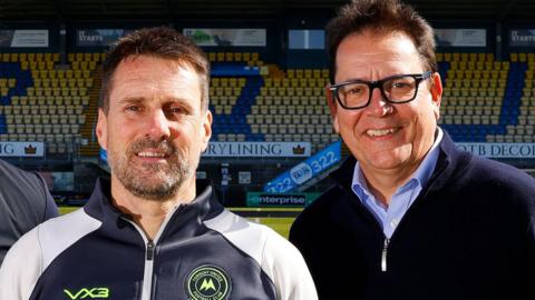Michael Westcott (right) poses with Torquay United manager Jimmy Ball
