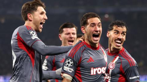 Olympiakos' Santiago Hezze celebrates goal against Ajax