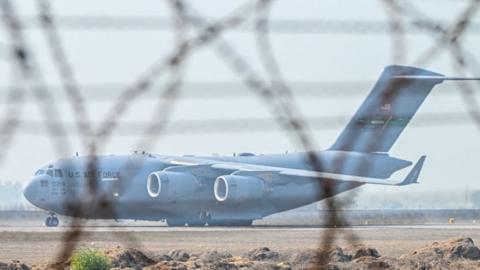 A US Air Force C-17 Globemaster III aircraft carrying undocumented migrants 