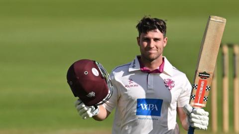 Jordan Hermann of Somerset celebrates a century during the Rothesay County Championship One match between Nottinghamshire County Cricket Club and Somerset County Cricket Club at Trent Bridge, Nottingham