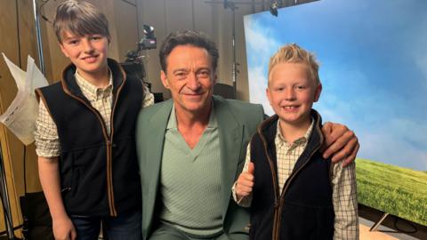 Hugh Jackman with brothers William and Jack. 