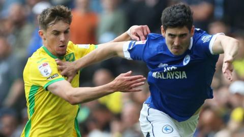 Callum O'Dowda (right) of Cardiff City runs at Ruairi McConville of Norwich City