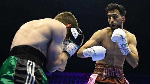 Saqib Mehmood prepares to throw a punch at Simas Volosinas 