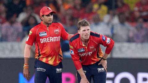 Lockie Ferguson grimaces after injury