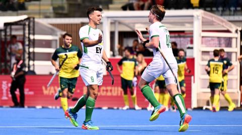 Matthew Nelson and Ali Empey celebrate Ireland’s goal